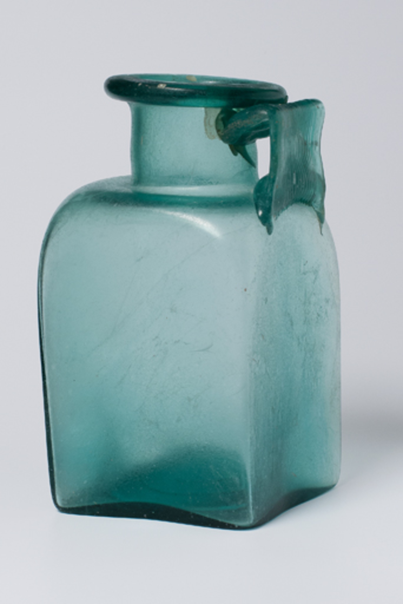 Square one-handled bottle, ash urn